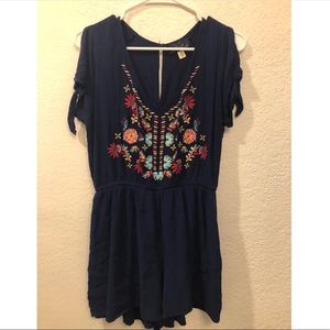 Francesca’s navy blue embroidered romper